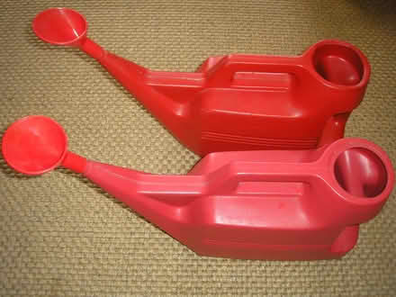 Photo of free Two red plastic watering cans (Chapeltown LS7) #2