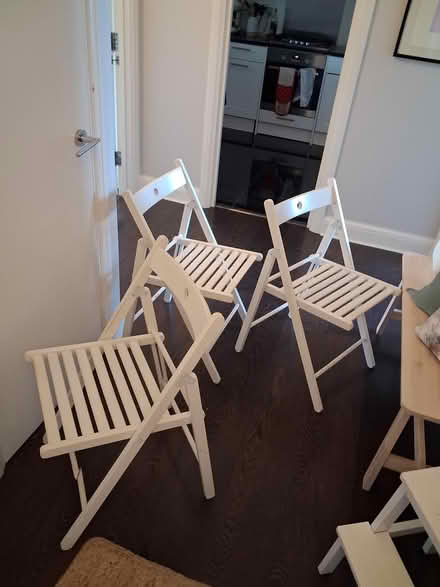 Photo of free Three IKEA fold up white chairs (Islington N1) #1