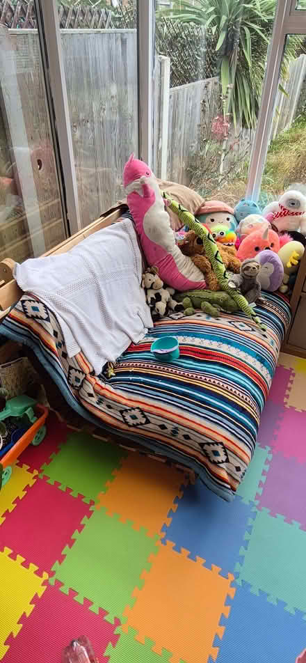 Photo of free Wooden futon sofa with brown cushion (Lowestoft NR32) #1