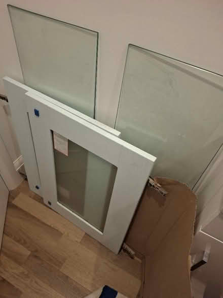 Photo of free Wren kitchen cupboard with blue doors and glass shelves. (Glen Parva LE2) #2