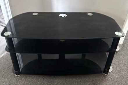 Photo of free Black glass Tv stand (NE9) #1
