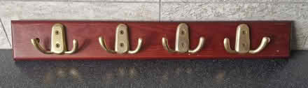Photo of free Board of 4 brass hooks (Belper) #1