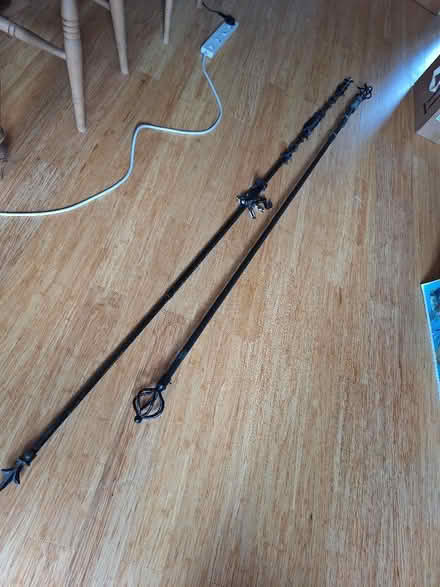 Photo of free 2 black metal curtain poles. (Chalford Hill GL6) #1