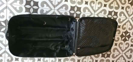 Photo of free Medium size black suitcase, broken wheel (Wokingham RG40) #2
