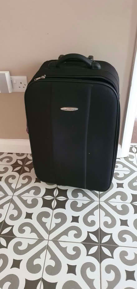 Photo of free Medium size black suitcase, broken wheel (Wokingham RG40) #1