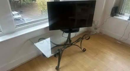 Photo of free Rectangular glass table (wrought iron scroll base) (Highbury N1) #1