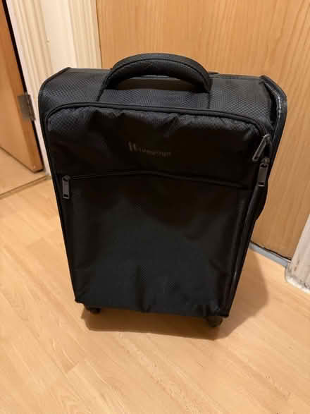Photo of free Carry on luggage - corner ripped (N7) #1