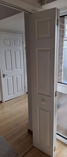 Photo of free 6-panel, wood grain textured, white, Bi-Fold Internal Door (Dursley GL11) #1