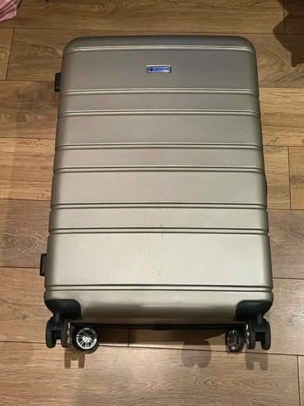 Photo of free Large suitcase with half wheel (Dalston junction E8) #1