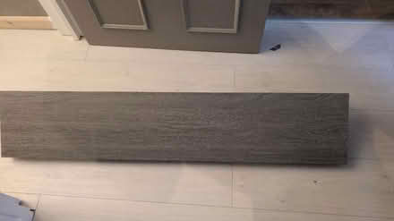 Photo of free Grey wood effect shelf + brackets (E6 5RN) #1