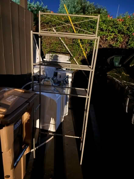 Photo of free Tall metal storage rack, 3 shelves (1075 Valencia Avenue) #1