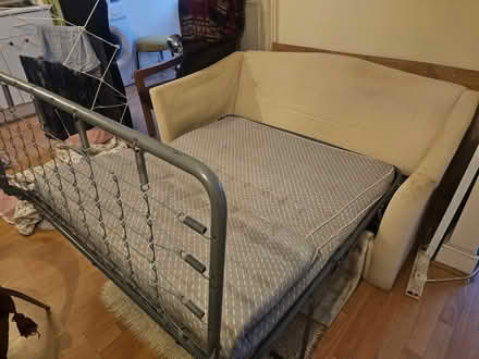 Photo of free A two seater sofa with a fold away camp bed inside (Queens Park W10) #4