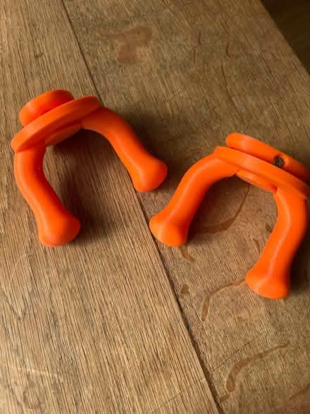 Photo of free Pair of orange electric guitar wall hangers (Little Herberts GL53) #1