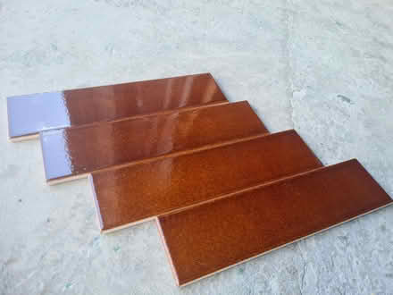 Photo of free 18 boxes of dark slightly textered Amber tiles (Red Scar PR2) #1