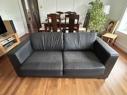 Photo of free Sofa black leather 2.5 seater (Richmond TW10) #1