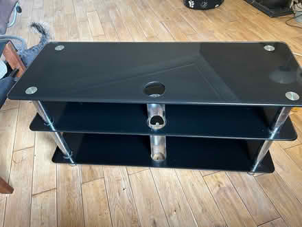 Photo of free Black glass tv table (G14 9hz) #1