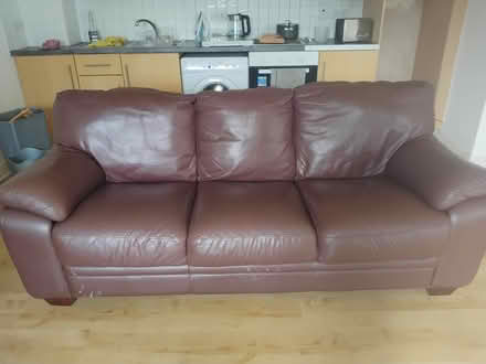 Photo of free Brown leather sofa (Oscar Traynor Rd, Coolock) #1