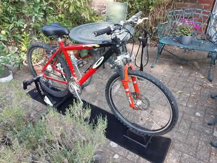 Photo of free Cycle trainer and bike wheel (Reigate RH2) #4