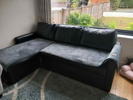 Photo of free Black corner settee (Ware SG12) #1