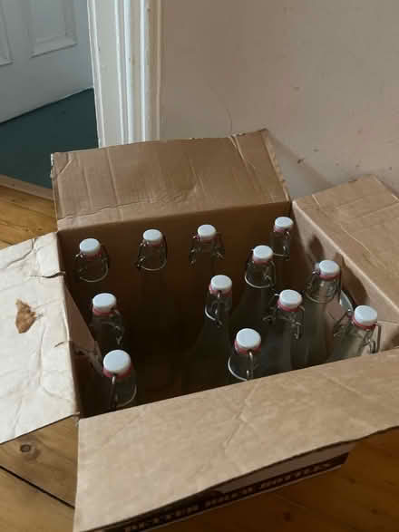 Photo of free 12 clear glass flip-top bottles (Bellevue EH7) #1