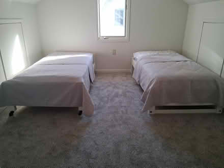 Photo of free Single beds (1307 Cedar St. Alex. MN, alley) #3