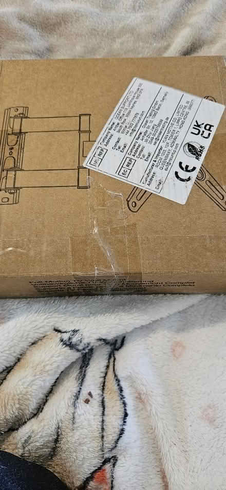 Photo of free Tv bracket still in box (Hook RG27) #1