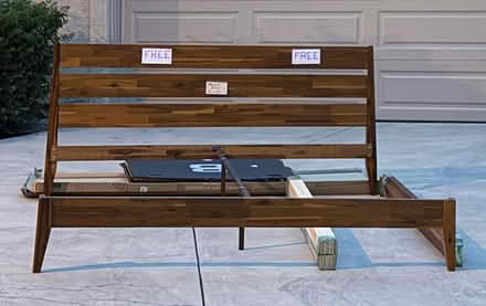 Photo of free Standard King wood bedrame (Captains Hill condos) #1