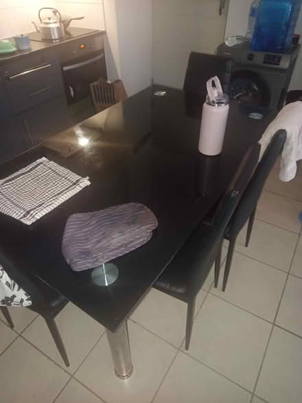 Photo of free Black glass dining table and chairs (Table View) #1