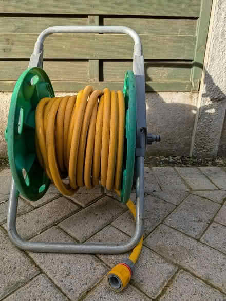Photo of free Hozelock hose pipe with stand (Harrogate HG2) #1