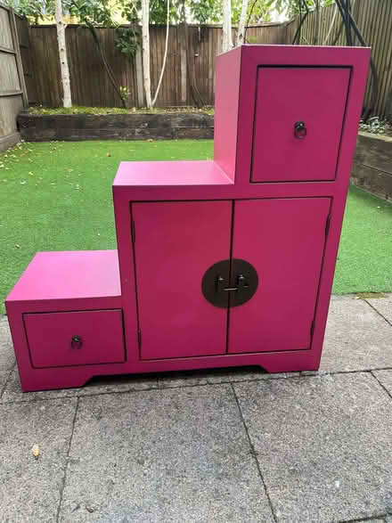 Photo of free Bright pink tiered step cupboard (Dollis Hill NW2) #1