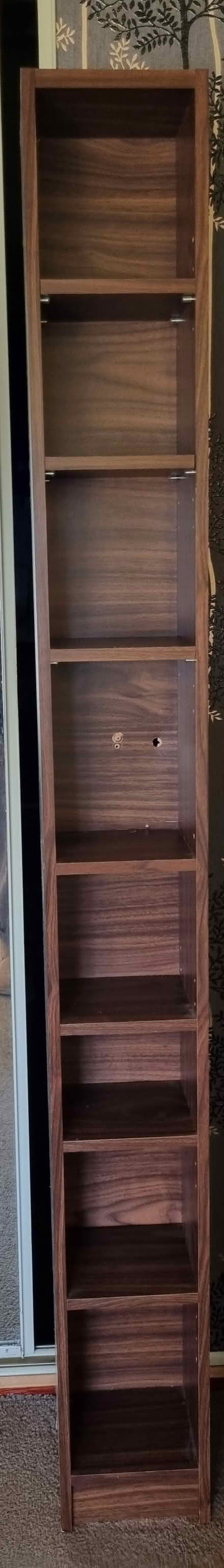 Photo of free Tall mahogany DVD, CD or book shelf (Kempston MK42) #1