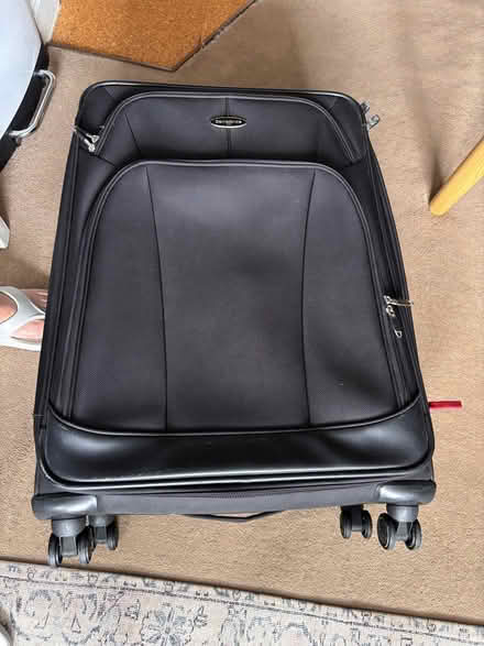 Photo of free Large black luggage, 4 wheels (Wandsworth Common SW17) #1