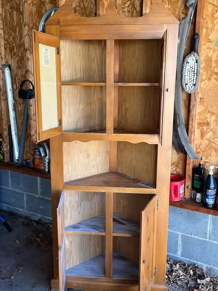 Photo of free Corner Cabinet (W. Poplar Rd., Sterling) #1