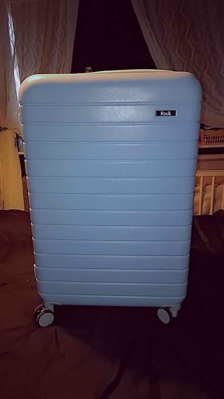 Photo of free 2x large blue suitcases (HX2) #1