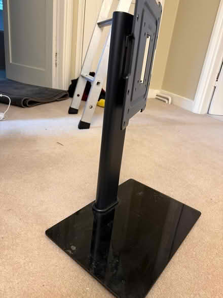 Photo of free Black metal TV stand (Bookham) #2