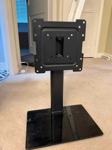 Photo of free Black metal TV stand (Bookham) #1