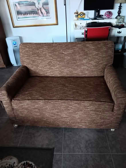 Photo of free Loveseat/twin bed (Off of Marilyn Pkwy.) #1