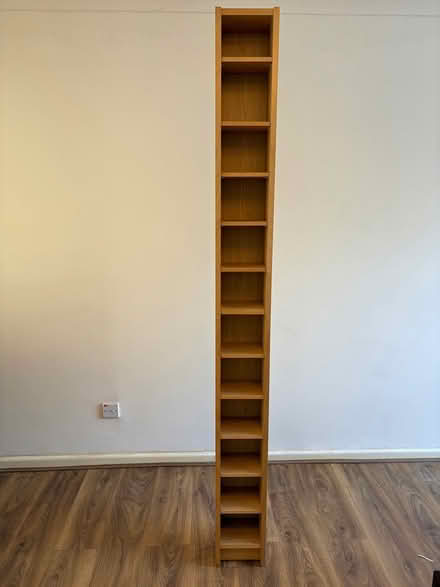 Photo of free Tall wooden CD Rack (Letchworth, SG6) #1