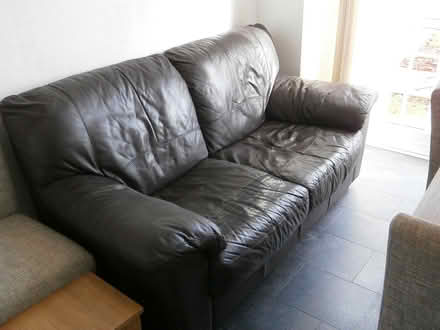 Photo of free Three seater black leather sofa (Abergavenny) #1
