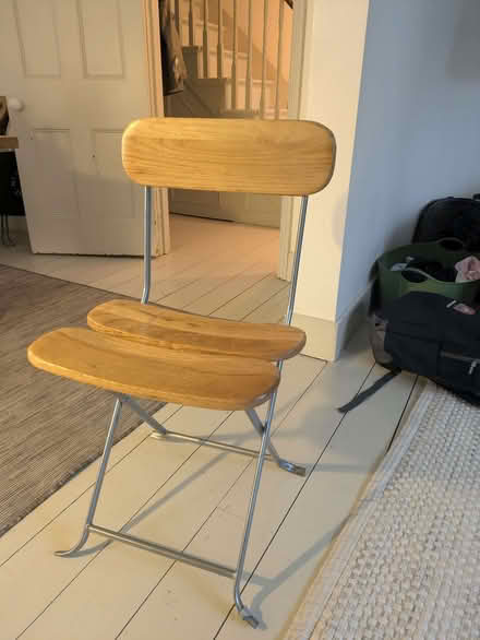 Photo of free 4 wooden chairs folding on metal legs (Loftus Road W12) #1