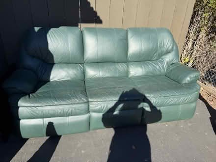 Photo of free Green leather sofa (Valencia Avenue, Sunnyvale) #1