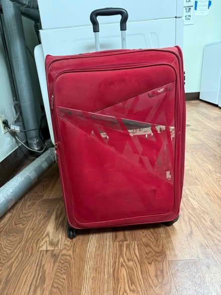 Photo of free Large rolling suitcase (Valencia Avenue, Sunnyvale) #1