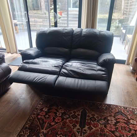 Photo of free Comfortable two-seater recliner sofa in black leather. (Stroud Green N4) #3