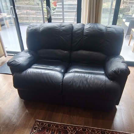 Photo of free Comfortable two-seater recliner sofa in black leather. (Stroud Green N4) #1