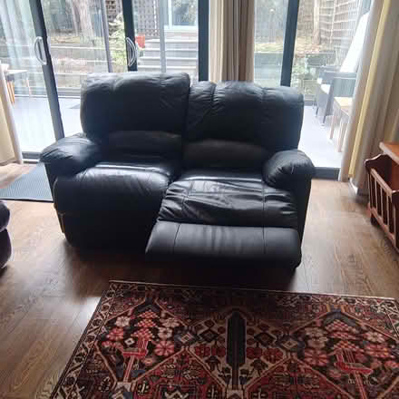 Photo of free Comfortable two-seater recliner sofa in black leather. (Stroud Green N4) #2